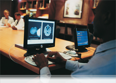 Close up image of a doctor using a computer.